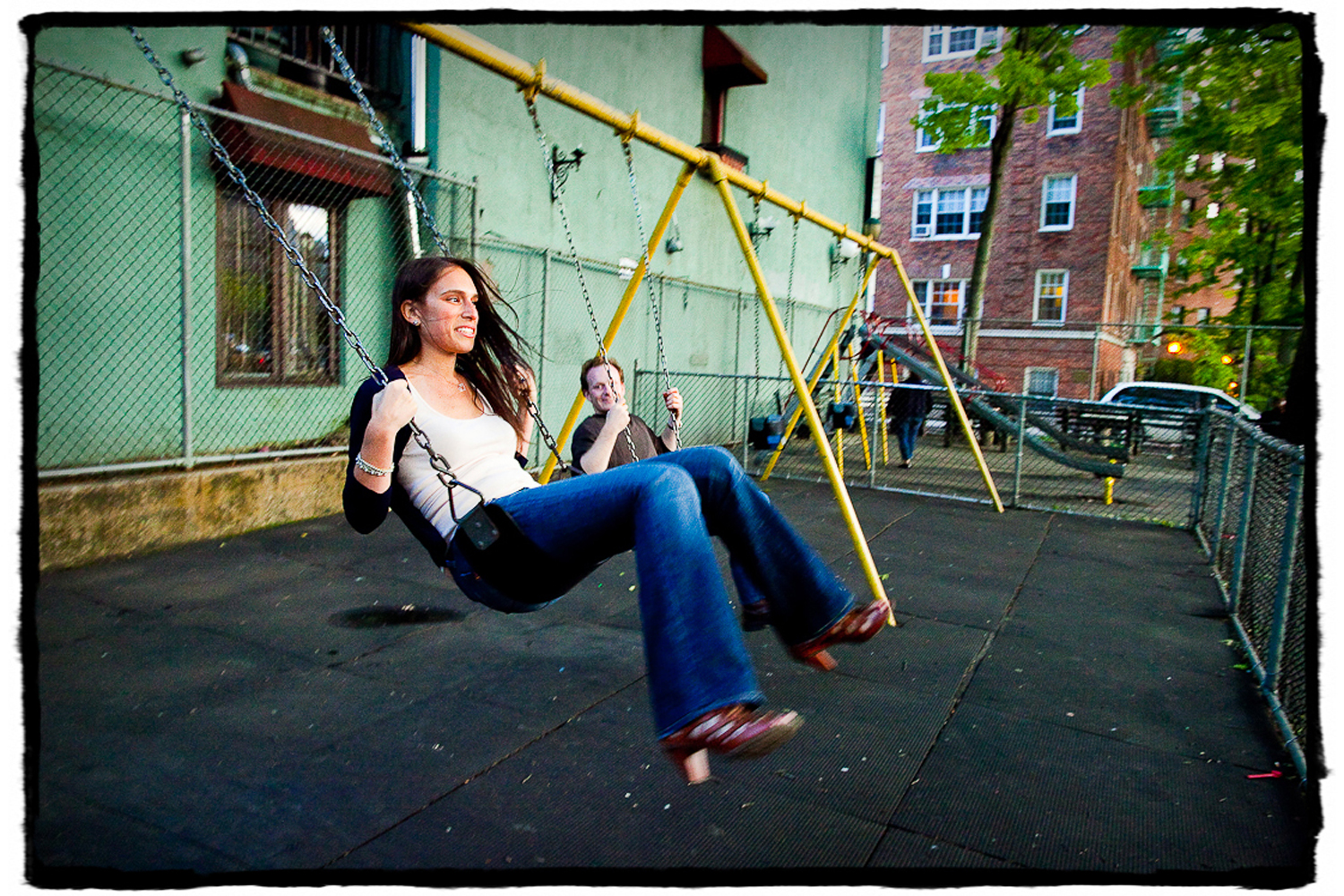 Engagement Portrait: Alex & Michelle goof around on a local playground in the West Village.
