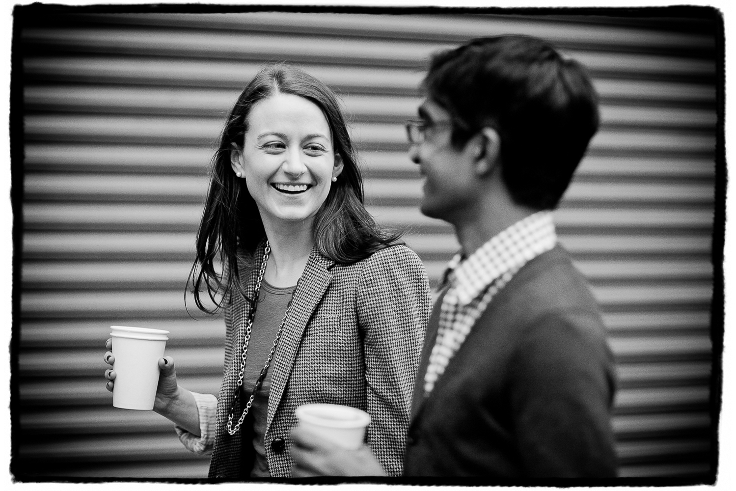 Engagement Portraits: Katie & Sharmilan walk and talk with coffee from their favorite cafe.