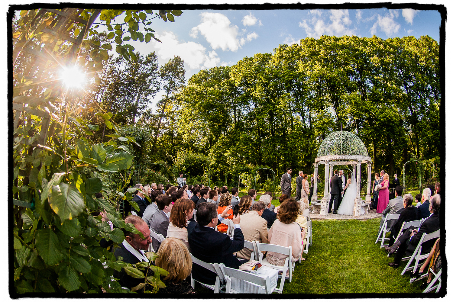 Michelle and Dan's summer ceremony in the rose garden gazebo at Lyndhurst Castle in Westchester NY.