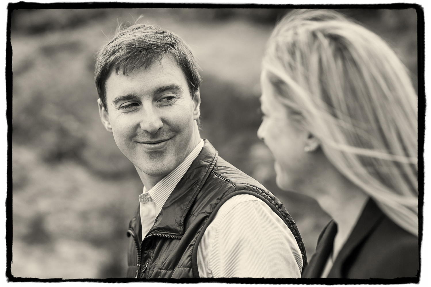 Engagement Portraits: Tim gives Noelle a loving look as they walk through Central Park.