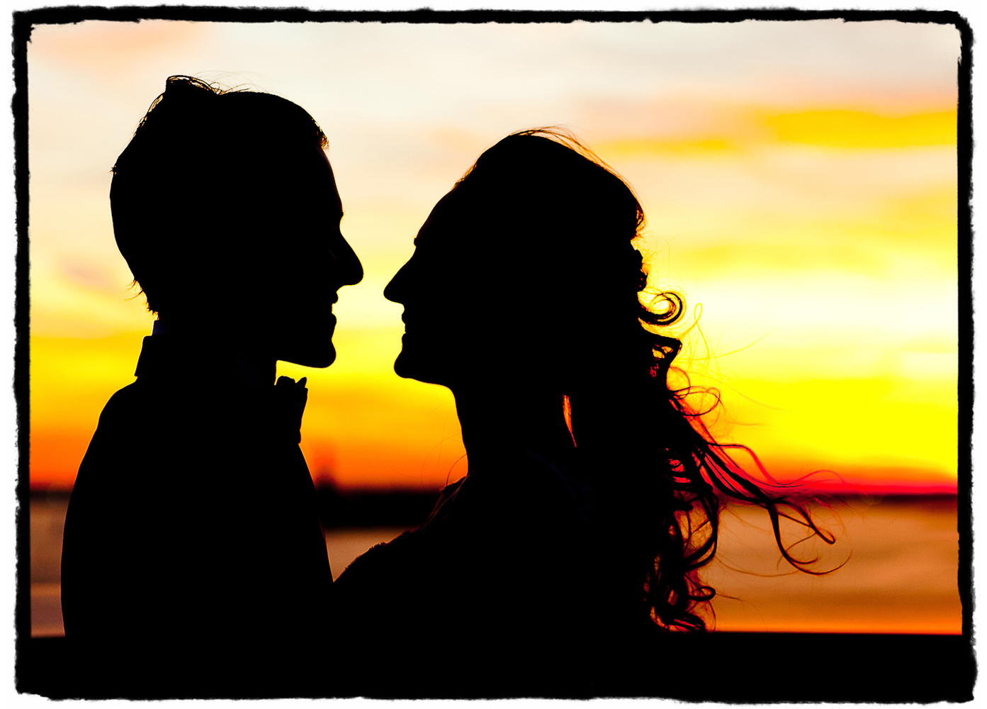 The sky at sunset was perfect for this couple's silhouette on the roof of the Ritz-Carlton at Battery Park in Manhattan just before their ceremony..