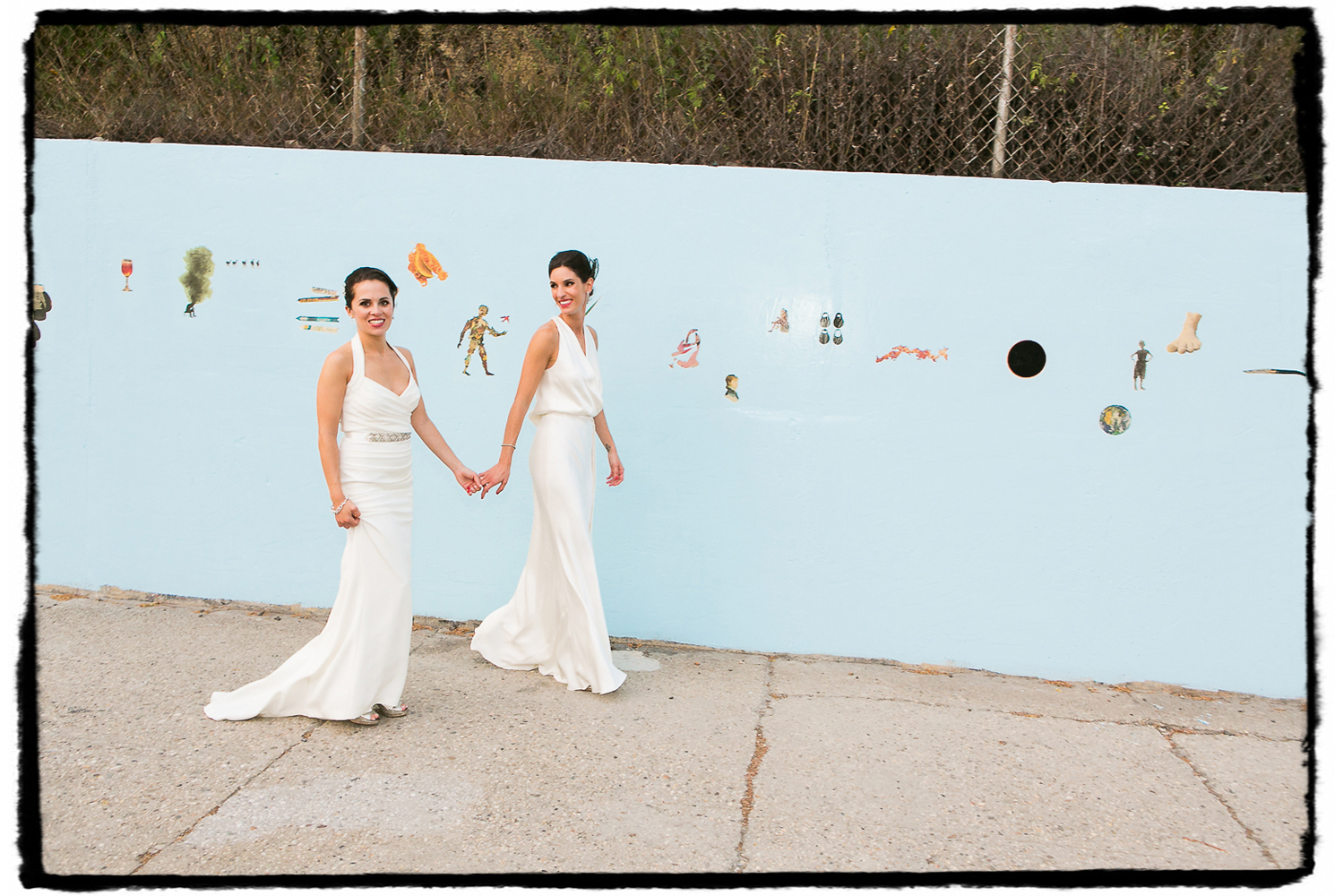Lara and Nicole were married at The Green Building in Brooklyn and on that very day an artist was painting this particular mural behind them.  It's gone now but will live on in their wedding photographs.