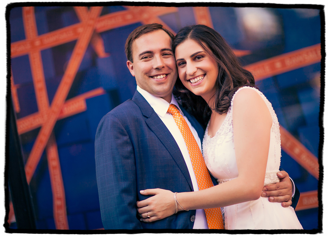 Marisa and Nolan were married at Housing Works Bookstore in Soho.  We walked around the neighborhood and when I saw the blue and orange tones on this signage and how they would match the groom's suit and tie I just had to shoot them with it.