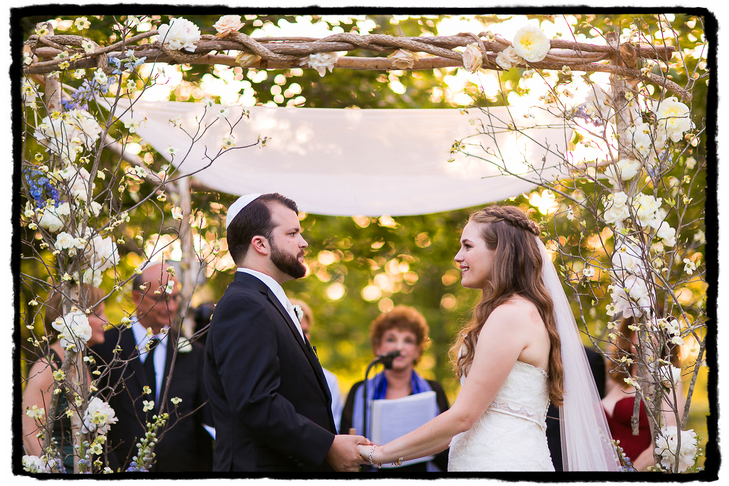 Alex & Will tie the knot under a floral Chuppah by Rebecca Sheperd at The Palm House at Brooklyn Botanic Garden.